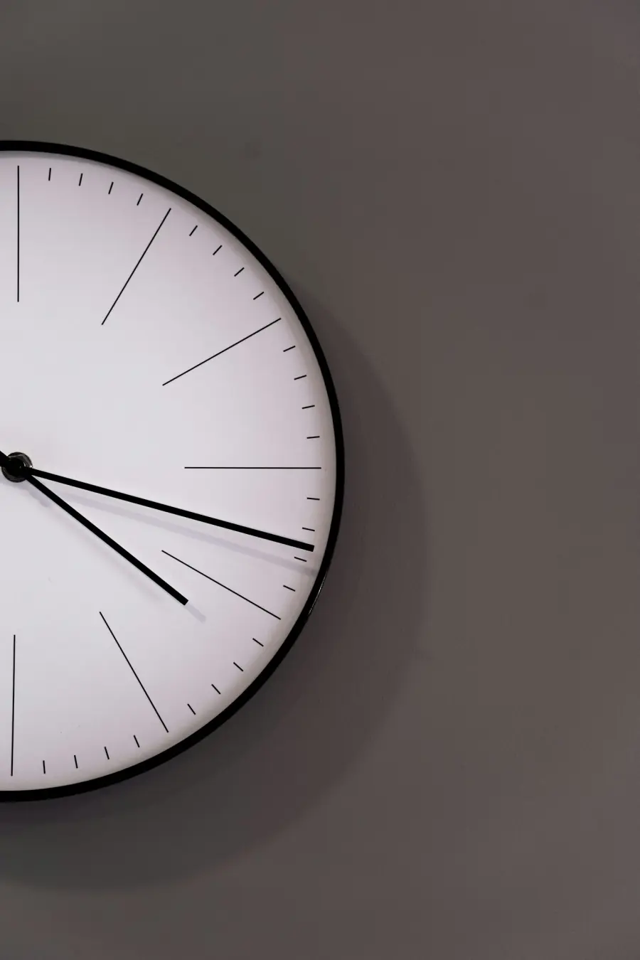 A close-up of a simple wall clock